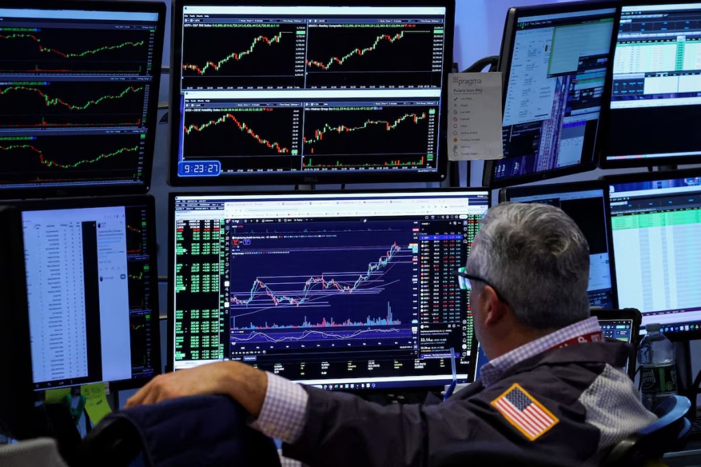 A trader works on the floor at the New York Stock Exchange (NYSE) in New York City, U.S., November 10, 2025. REUTERS