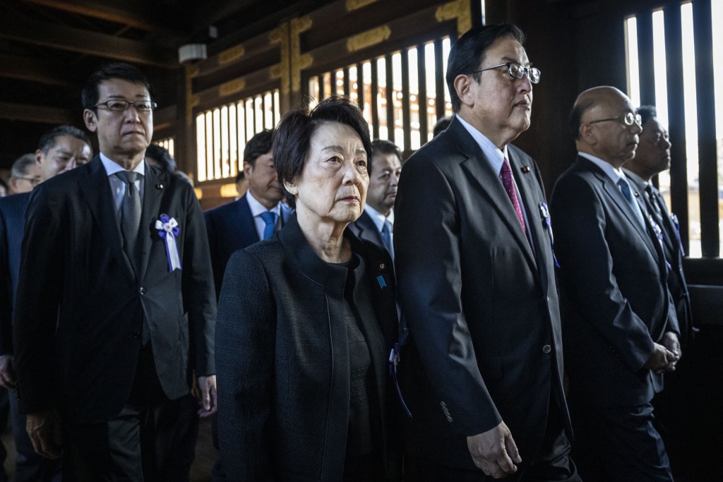 A group of Japanese lawmakers visit Yasukuni Shrine during its autumn festival in Tokyo on October 17, 2025. (Photo by Yuichi YAMAZAKI / AFP)