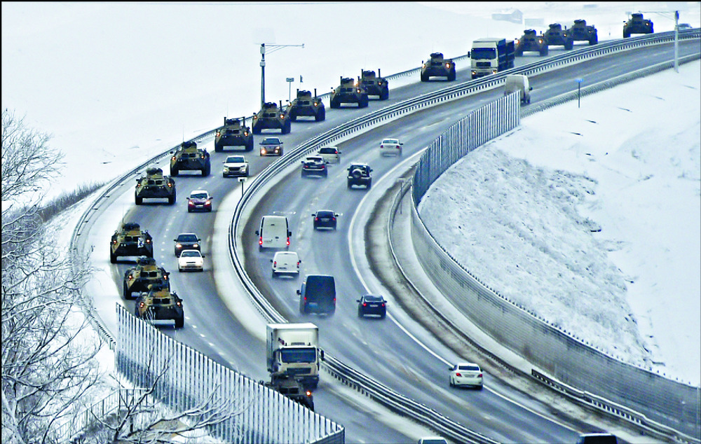 Russian armored vehicles move along a highway in Crimea. AP Russian armored vehicles move along a highway in Crimea. AP