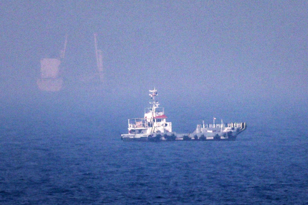 Photo by - / AFP  This picture shows ships sailing near the Strait of Hormuz off the eastern coast of the United Arab Emirates at Khor Fakkan on July 13, 2026.