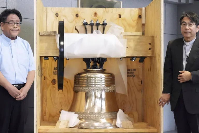 1 of 3 | The bell, which was reproduced and returned by a group of Americans, is shown to the media at the Urakami Cathedral, nearly 80 years after the cathedral was destroyed by the U.S. atomic bombing near the end of World War, in Nagasaki, western Japan, on May 15, 2025. (Kyodo News via AP)
