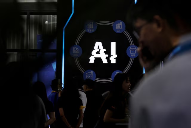 FILE PHOTO: Visitors stand near a sign of artificial intelligence at an AI robot booth at Security China, an exhibition on public safety and security, in Beijing, China June 7, 2023. REUTERS/Florence Lo/File Photo