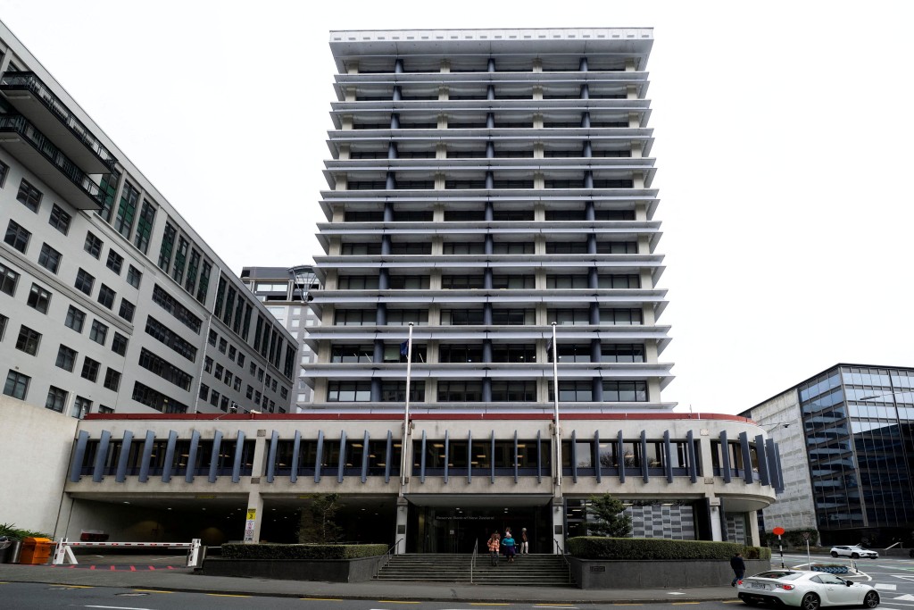 People exit the Reserve Bank of New Zealand building in Wellington, New Zealand, September 24, 2025. REUTERS/Marty Melville/File Photo