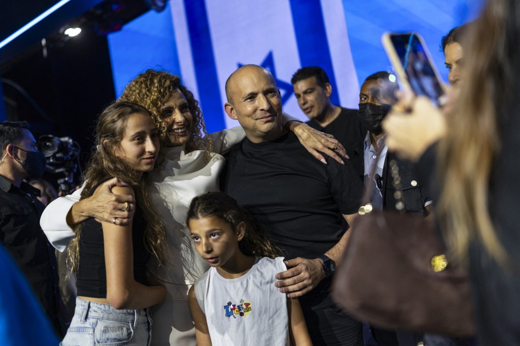 Photo by ILIA YEFIMOVICH / AFP Former Israeli prime minister Naftali Bennett takes pictures with supporters during a B'Yachad (Together) party as the party presents their candidates ahead of Israel's legislative elections in Tel Aviv on September 6, 2026.