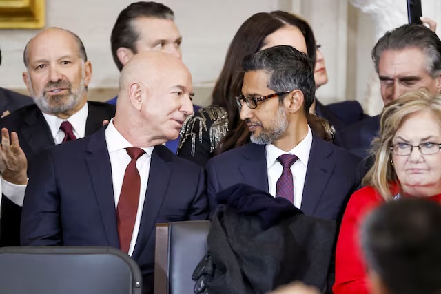 Businessman Jeff Bezos (L) talks with Sundar Pichai (R) at Donald Trump’s inauguration as the next President of the United States in the rotunda of the United States Capitol in Washington, DC, USA, 20 January 2025. SHAWN THEW/POOL/Pool via REUTERS