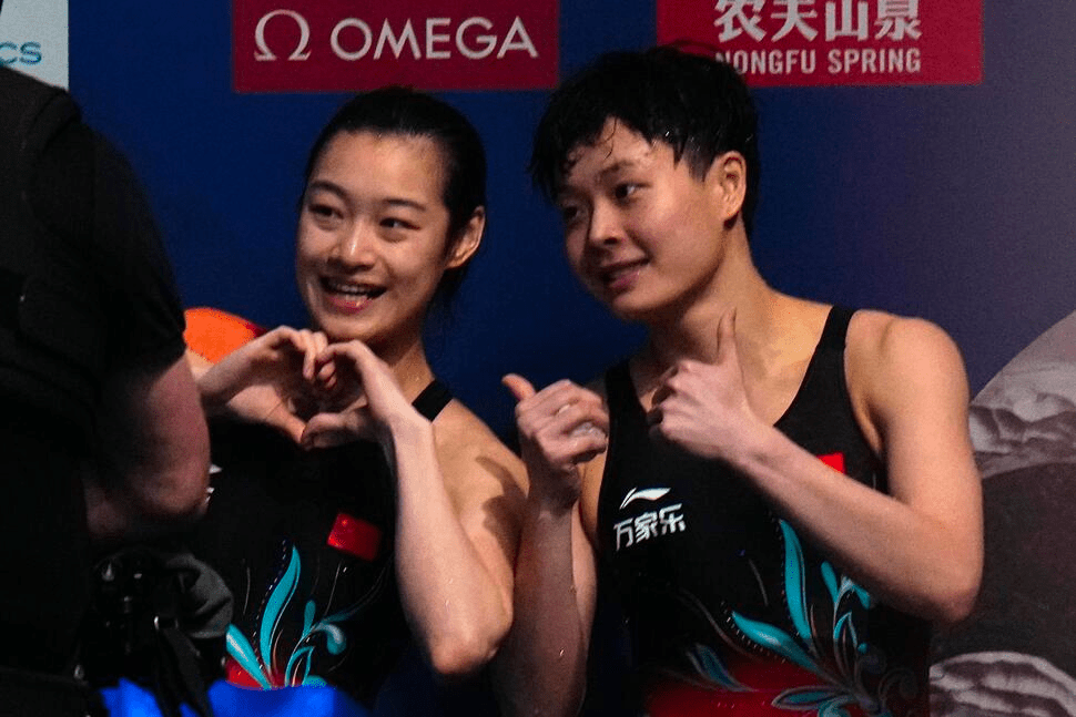 Chang Yani of China, left, and Chen Yiwen of China gesture after winning gold and silver during the women's 3m springboard diving final at the World Aquatics Championships in Doha, Qatar, Friday, Feb. 9, 2024. (AP Photo/Hassan Ammar) Chang Yani of China, left, and Chen Yiwen of China gesture after winning gold and silver during the women's 3m springboard diving final at the World Aquatics Championships in Doha, Qatar, Friday, Feb. 9, 2024. (AP Photo/Hassan Ammar)