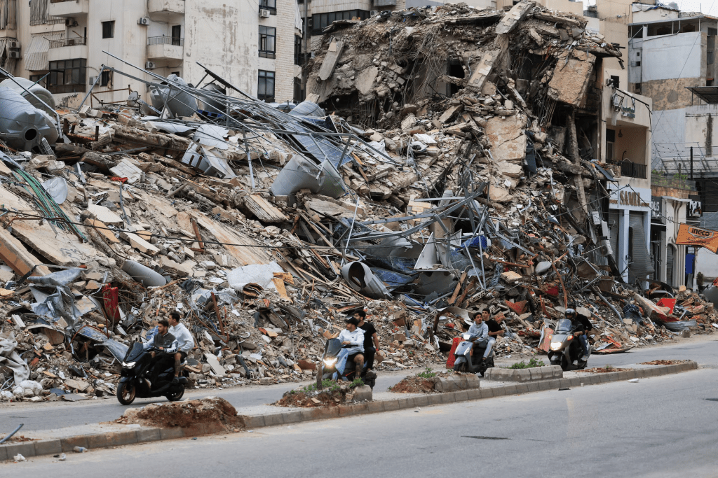 Displaced people make their way as they return to their homes after a 10-day ceasefire between Lebanon and Israel went into effect, in the southern suburbs of Beirut, Lebanon, April 17. REUTERS/Mohamed Azakir