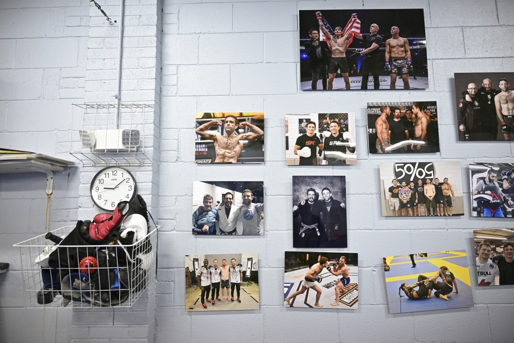 Photo by OLIVER CONTRERAS / AFP Pictures hangs on a wall at Fifty/50 Martial Arts Academy on June 2, 2026, in Falls Church, Virginia.