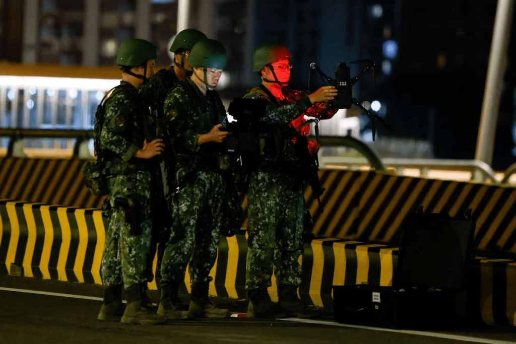 Members of Taiwan's military prepare a drone during a blockade exercise on the Danjiang Bridge during the annual Han Kuang military exercise in New Taipei City, Taiwan, August 6, 2026. REUTERS/Ann Wang
