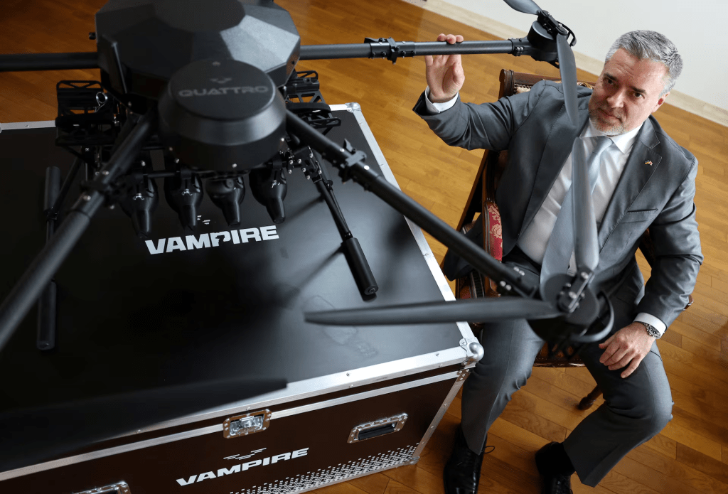 Ukraine's Ambassador to Japan Yurii Lutovinov poses for a photograph next to a mockup of Ukrainian-made Vampire drone during an interview with Reuters at Ukraine Embassy in Tokyo, Japan April 28, 2026. REUTERS/Issei Kato