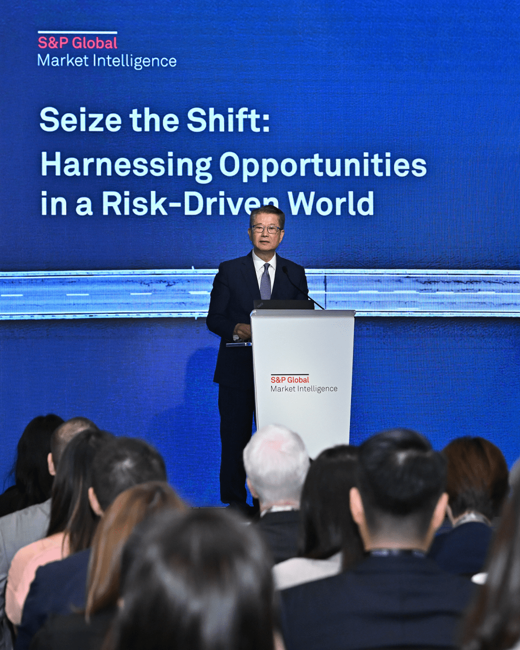 Paul Chan speaks at the S&P Global Market Intelligence Hong Kong Roadshow on June 5, 2025. 