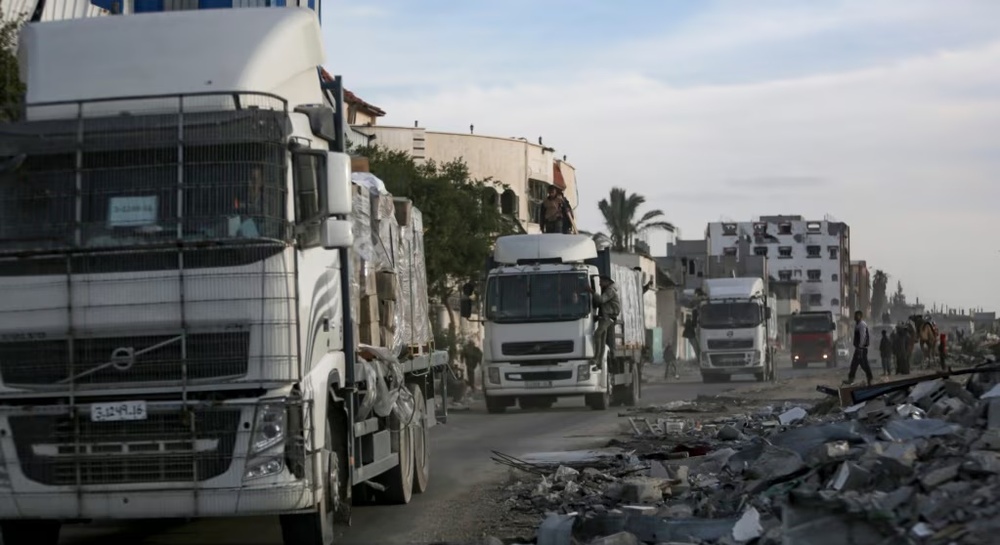 Humanitarian aid trucks enter through the Kerem Shalom crossing from Egypt into the Gaza Strip, as a ceasefire deal between Israel and Hamas went into effect, Jan. 19, 2025. Humanitarian aid trucks enter through the Kerem Shalom crossing from Egypt into the Gaza Strip, as a ceasefire deal between Israel and Hamas went into effect, Jan. 19, 2025.