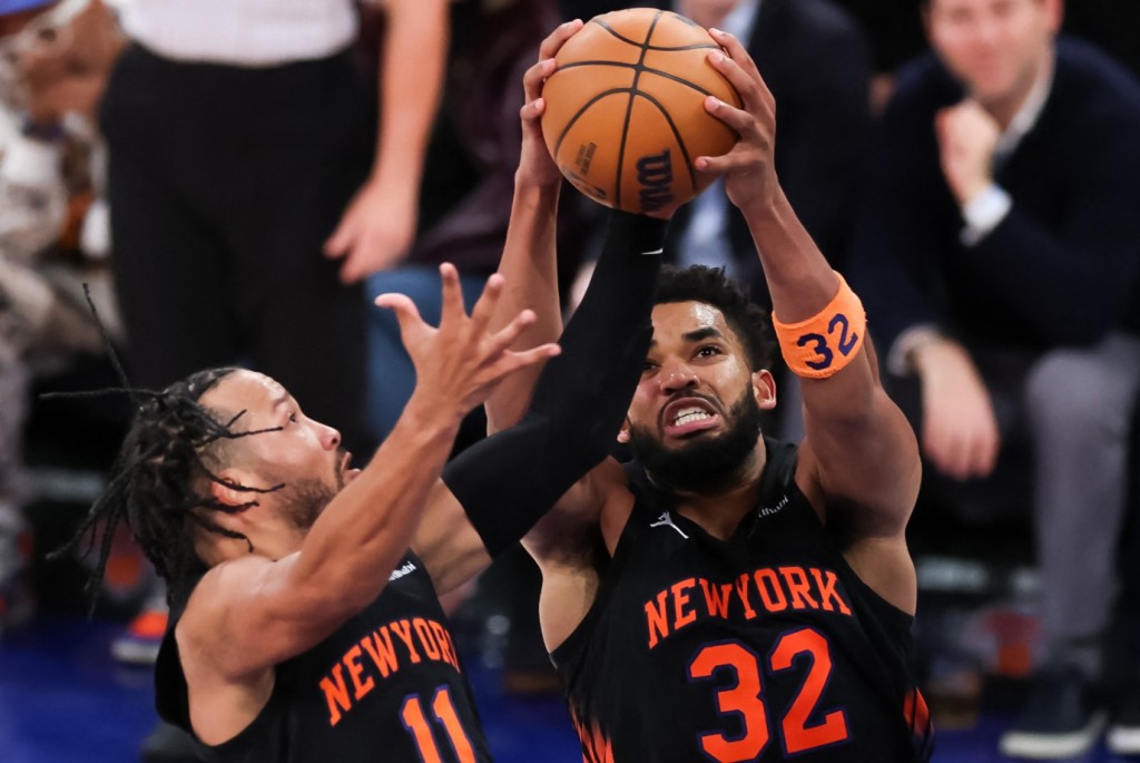 Karl-Anthony Towns secures the rebound ahead of Knicks teammate Jalen Brunson. AFP