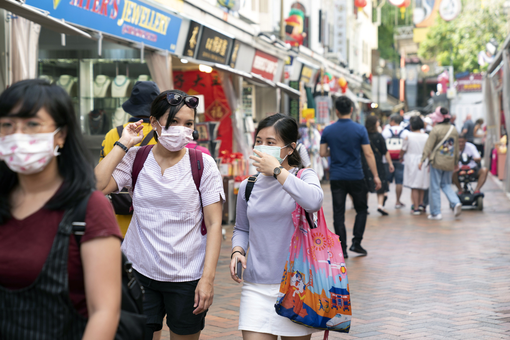 Pedestrians walk through the Chinatown area in Singapore, which is pushing through with a travel bubble with Hong Kong, according to Vivian Balakrishnan. BLOOMBERG, REUTERS Pedestrians walk through the Chinatown area in Singapore, which is pushing through with a travel bubble with Hong Kong, according to Vivian Balakrishnan. BLOOMBERG, REUTERS