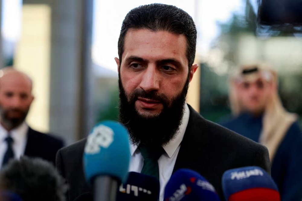 Syria's de facto leader Ahmed al-Sharaa, also known as Abu Mohammed al-Golani, speaks to the media during a meeting with Qatar's Minister of State Mohammed bin Abdulaziz Al-Khulaifi, after the ousting of Syria's Bashar al-Assad, in Damascus, Syria, December 23, 2024. REUTERS/Ammar Awad//File Photo Syria's de facto leader Ahmed al-Sharaa, also known as Abu Mohammed al-Golani, speaks to the media during a meeting with Qatar's Minister of State Mohammed bin Abdulaziz Al-Khulaifi, after the ousting of Syria's Bashar al-Assad, in Damascus, Syria, December 23, 2024. REUTERS/Ammar Awad//File Photo