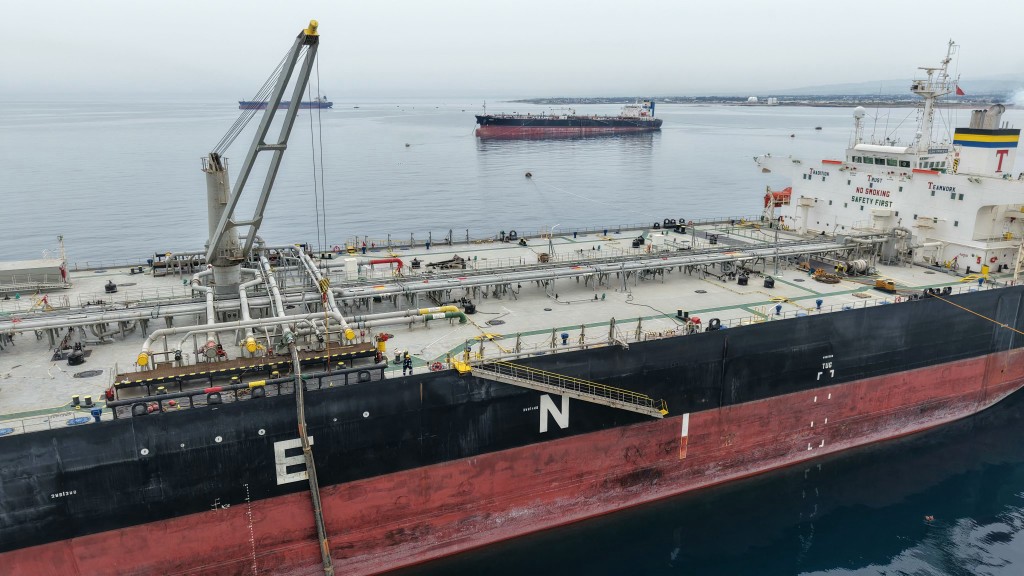 Photo by BAKR ALKASEM / AFP / The Greek-flagged crude oil tanker "Asahi Princess" is made ready at the Syrian Baniyas port refinery on the coast of the Mediterranean Sea on April 15, 2026.