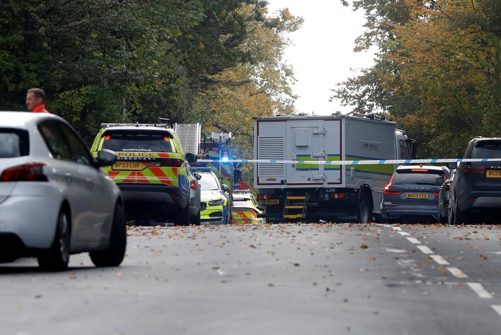 A bomb disposal robot works at the scene, after a report of an incident in which a car was driven at pedestrians and a stabbing attack outside a synagogue, in north Manchester, Britain, October 2, 2025. (Reuters)