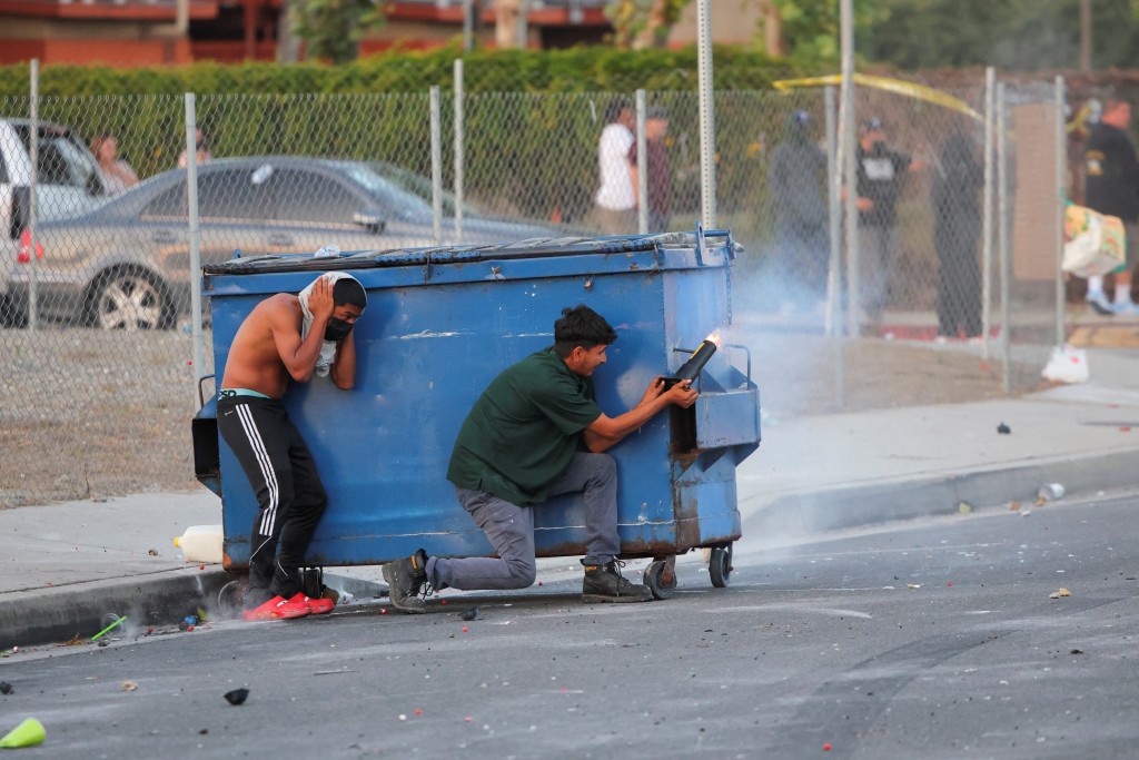 A protesters fires a firework during a standoff between police and protesters following multiple detentions by Immigration and Customs Enforcement (ICE), in the Los Angeles County city of Paramount, California, U.S., June 7, 2025. (Reuters)