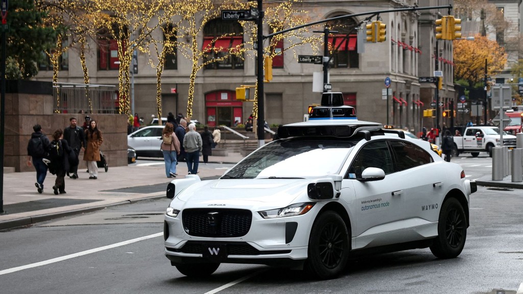 Waymo driverless taxi drives in lower Manhattan in New York. Reuters