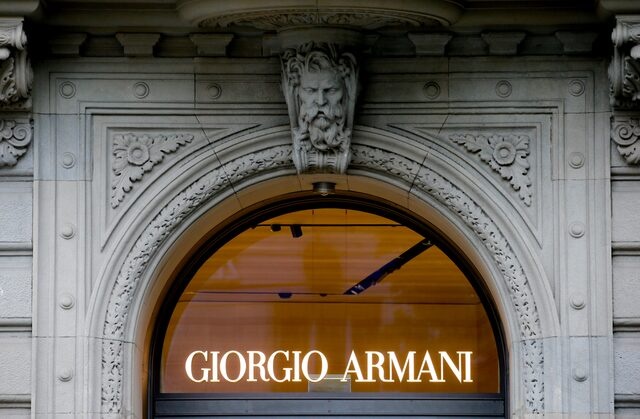 The logo of Italian fashion company Giorgio Armani is seen at a shop in Zurich, Switzerland July 8, 2021. REUTERS/Arnd Wiegmann/File Photo