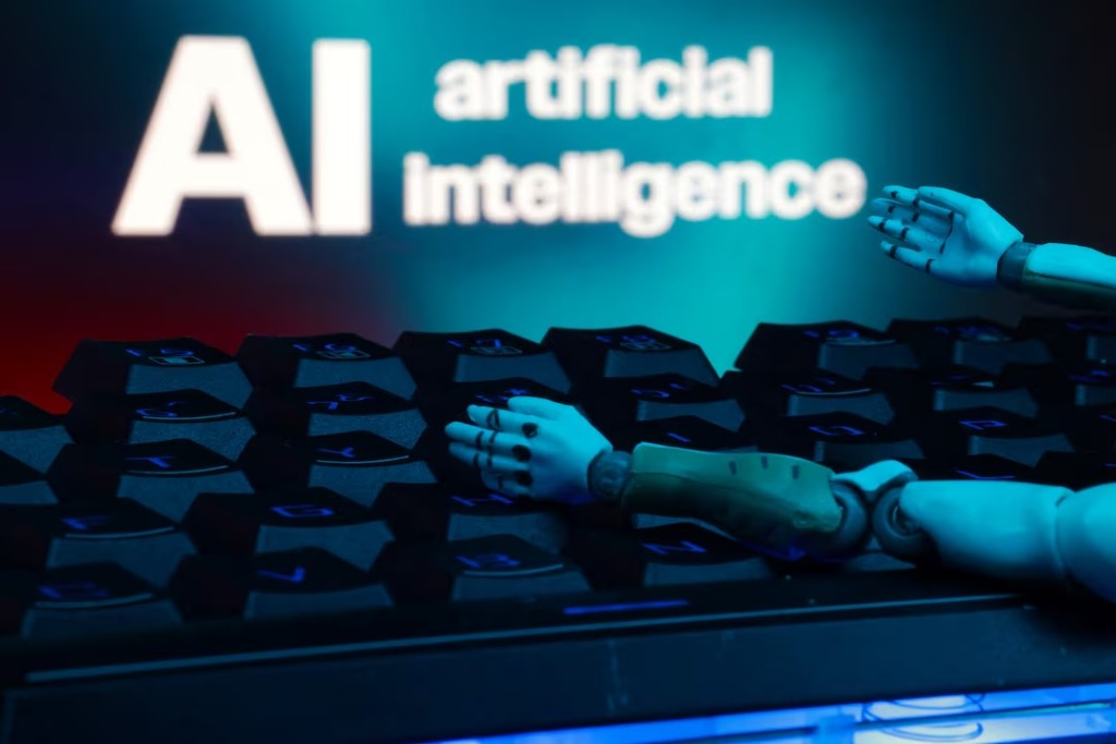 A message reading "AI artificial intelligence", a keyboard, and robot hands are seen in this illustration taken January 27, 2025. REUTERS/Dado Ruvic/Illustration