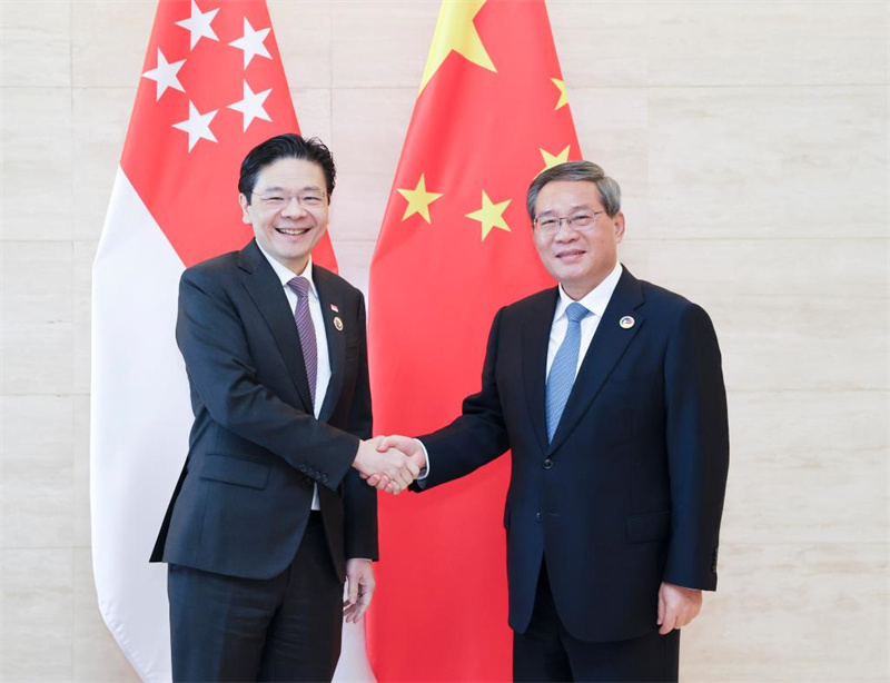 Chinese Premier Li Qiang meets with Singaporean Prime Minister Lawrence Wong on the sidelines of the leaders' meetings on East Asia cooperation held in Vientiane, Laos, Oct. 11, 2024. (File Phoro)