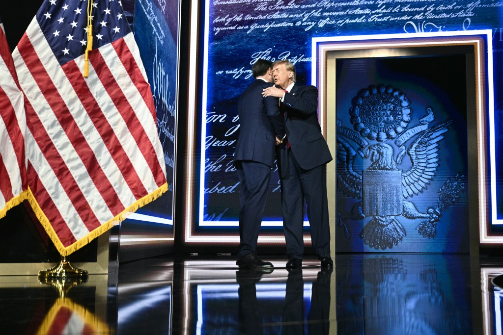 Photo by BRENDAN SMIALOWSKI / AFP  US President Donald Trump greets US Vice President JD Vance onstage after Vance delivered remarks during the second day of the Republican National Committee midterm convention at the American Airlines Center in Dallas, Texas on September 10, 2026.