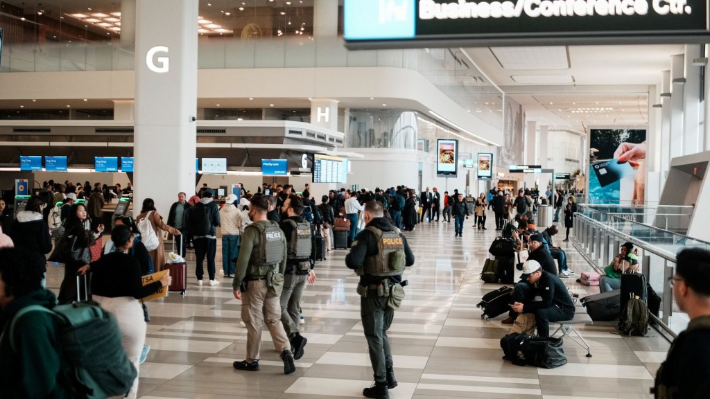Immigration and Customs Enforcement (ICE) agents patrol at LaGuardia International Airport. Reuters