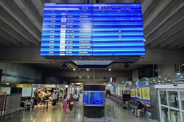 A view of a departures and arrivals screen is seen at the Simon Bolivar International airport in Maiquetia, La Guaira State, Venezuela June 3, 2024. REUTERS/Leonardo Fernandez Viloria