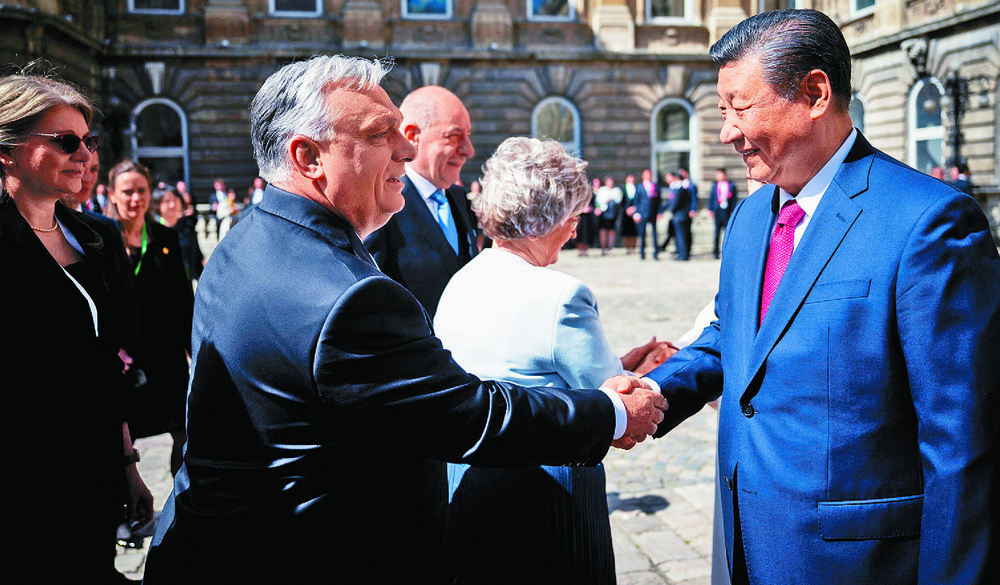 Xi Jinping and Hungarian President Tamas Sulyok stand at attention as soldiers ride past in a warm welcome for the Chinese delegation at Buda Castle in Budapest. Inset: Xi greets Viktor Orban ahead of their meeting. Xi Jinping and Hungarian President Tamas Sulyok stand at attention as soldiers ride past in a warm welcome for the Chinese delegation at Buda Castle in Budapest. Inset: Xi greets Viktor Orban ahead of their meeting.
