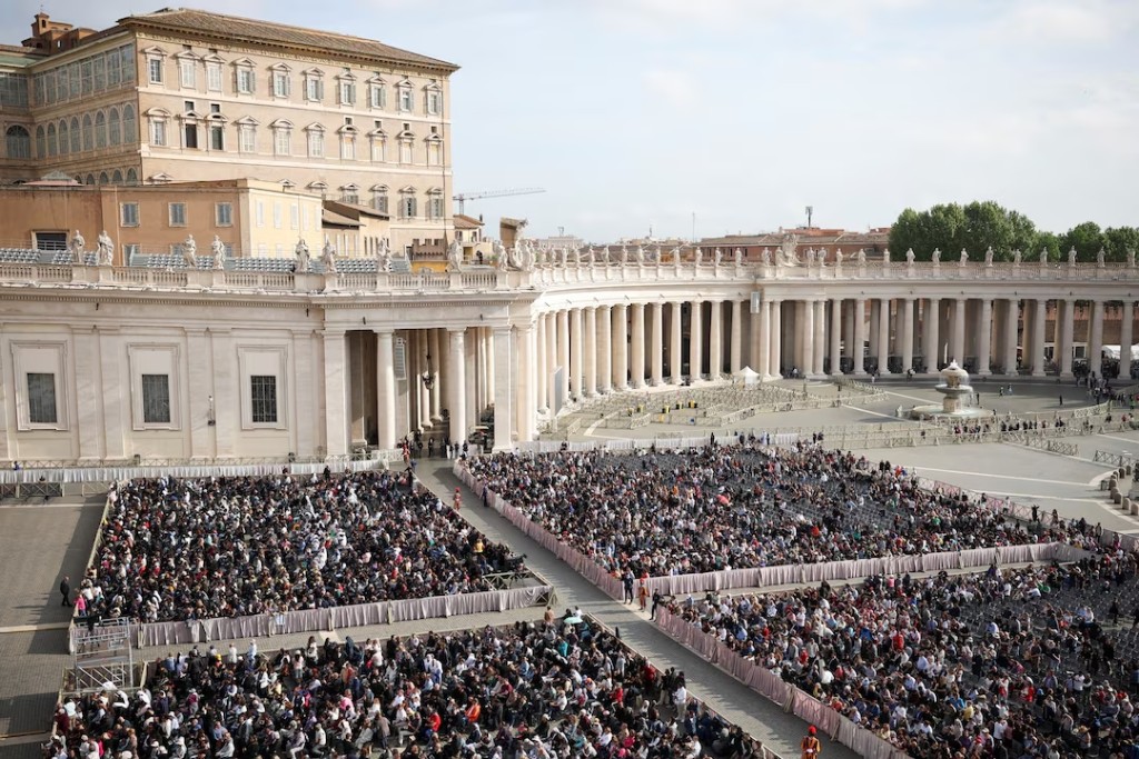 People gather in St Peter's Square on the day of the translation of Pope Francis' body, which will be transported inside the Basilica, at the Vatican, April 23, 2025. (Reuters)