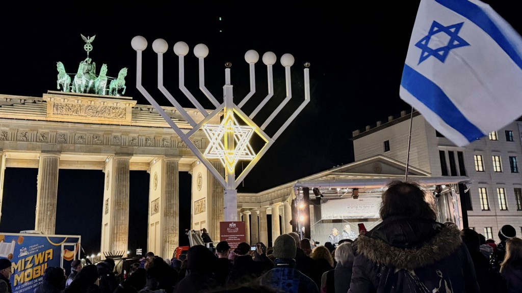Ceremonial lighting of the Hanukkah candlestick at Brandenburg Gate. Reuters