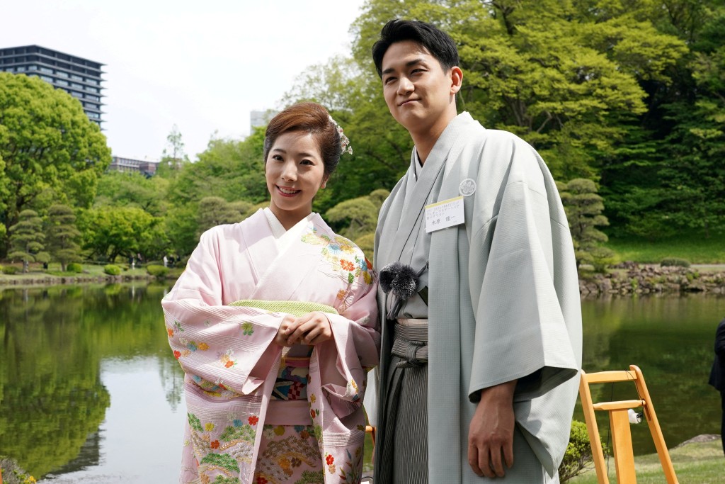 Japanese Olympic figure skating pairs champions Riku Miura (L) and Ryuichi Kihara (R) attend the spring garden party hosted by Japan's Emperor Naruhito and Empress Masako at the Akasaka Palace's imperial garden in Tokyo, Japan, April 17, 2026. (Reuters)