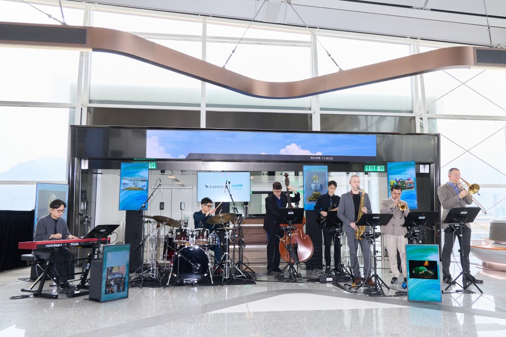 A band performed a live rendition of the newly reimagined Song of Cathay at the boarding gate of the inaugural passenger flight.