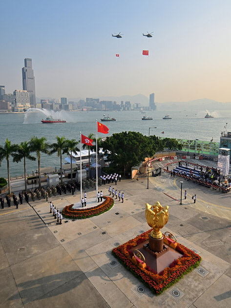 The disciplined services and the Government Flying Service perform a sea parade and a fly-past to mark the 70th National Day in 2019, at the Golden Bauhinia Square in Wan Chai. The disciplined services and the Government Flying Service perform a sea parade and a fly-past to mark the 70th National Day in 2019, at the Golden Bauhinia Square in Wan Chai.