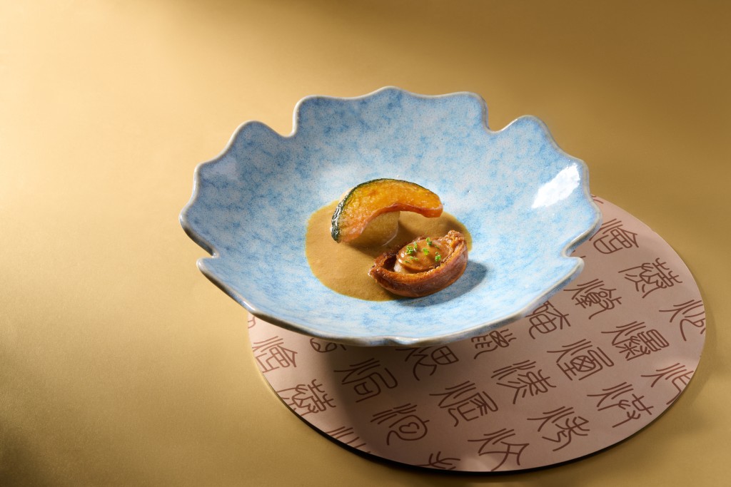 Cuisine Cuisine's braised abalone is served with chicken liver sauce, egg tofu and Japanese pumpkin, creating a rich combination of savory and subtly sweet flavors.