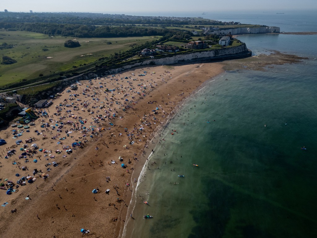 A drone view shows people on the beach at Joss Bay as temperatures climb over the bank holiday weekend due to a heat dome spreading across the region, in Broadstairs, Britain, May 24, 2026. (Reuters)