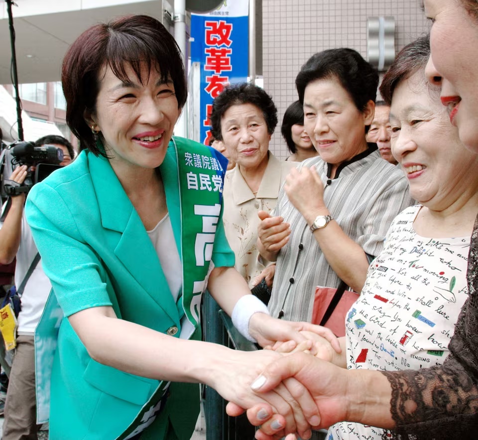 Sanae Takaichi, a Liberal Democratic Party candidate, shakes hands with supporters as the official campaign for the lower house elections kicks off, in Ikoma, Nara Prefecture, Japan, August 30, 2005 in this photo taken by Kyodo. Mandatory credit Kyodo/via REUTERS