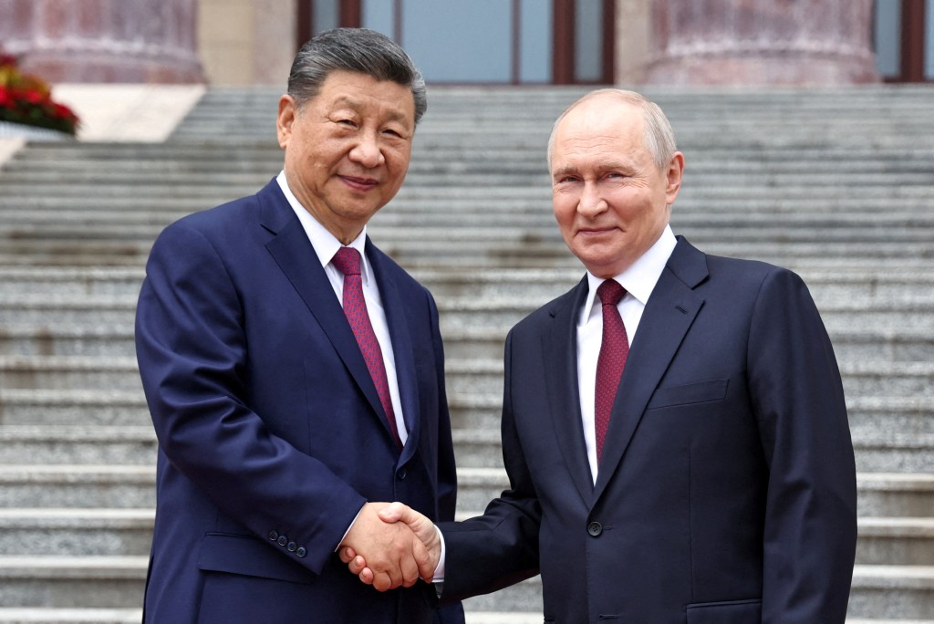 Russian President Vladimir Putin shakes hands with Chinese President Xi Jinping during a welcoming ceremony at the Great Hall of the People in Beijing, China May 20, 2026. (Reuters)
