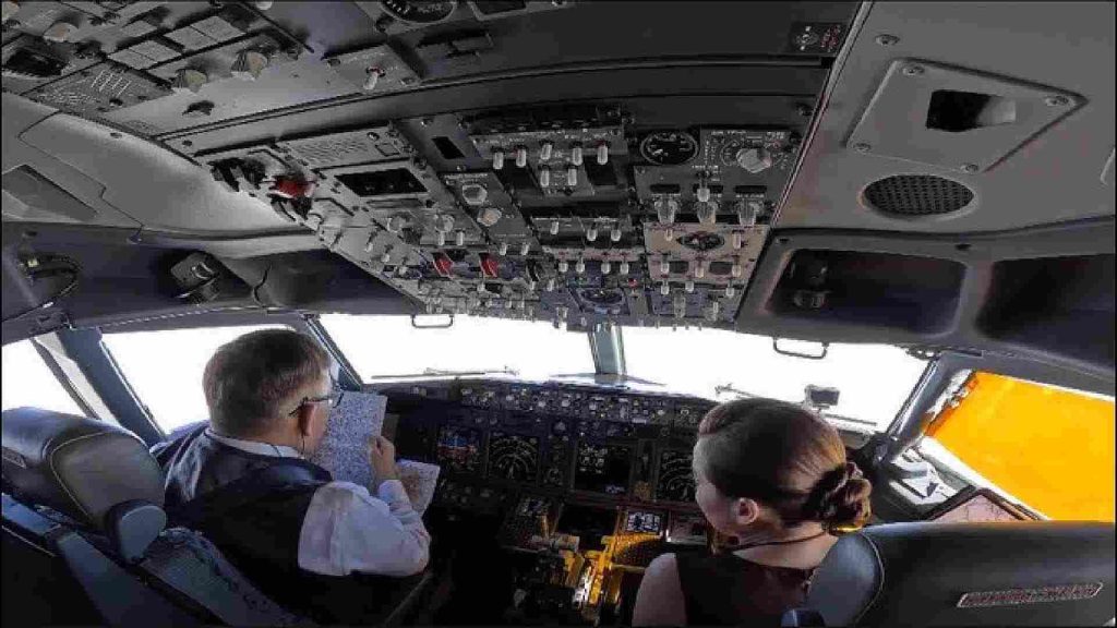 Thai royal couple piloting a jet.