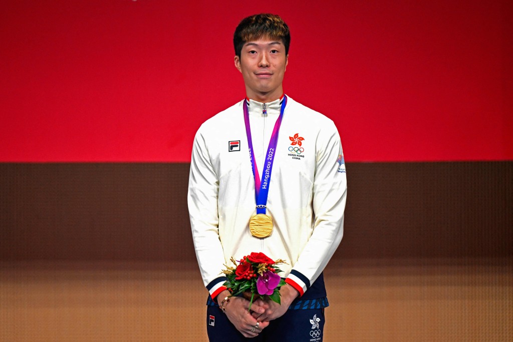 Cheung ka Long poses for a photograph during an award ceremony after bagging the gold medal at the men's individual foil fencing event during the 2022 Asian Games in Hangzhou in China's eastern Zhejiang province on September 24, 2023. AFP