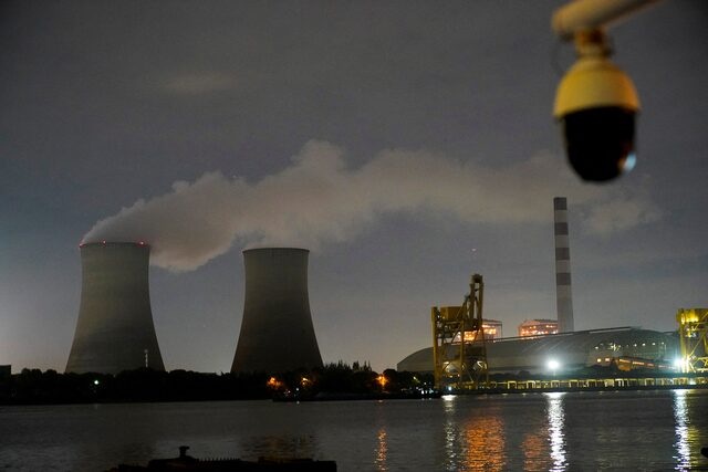 A surveillance camera is seen near a coal-fired power plant in Shanghai, China, October 14, 2021. REUTERS/Aly Song/File Photo A surveillance camera is seen near a coal-fired power plant in Shanghai, China, October 14, 2021. REUTERS/Aly Song/File Photo