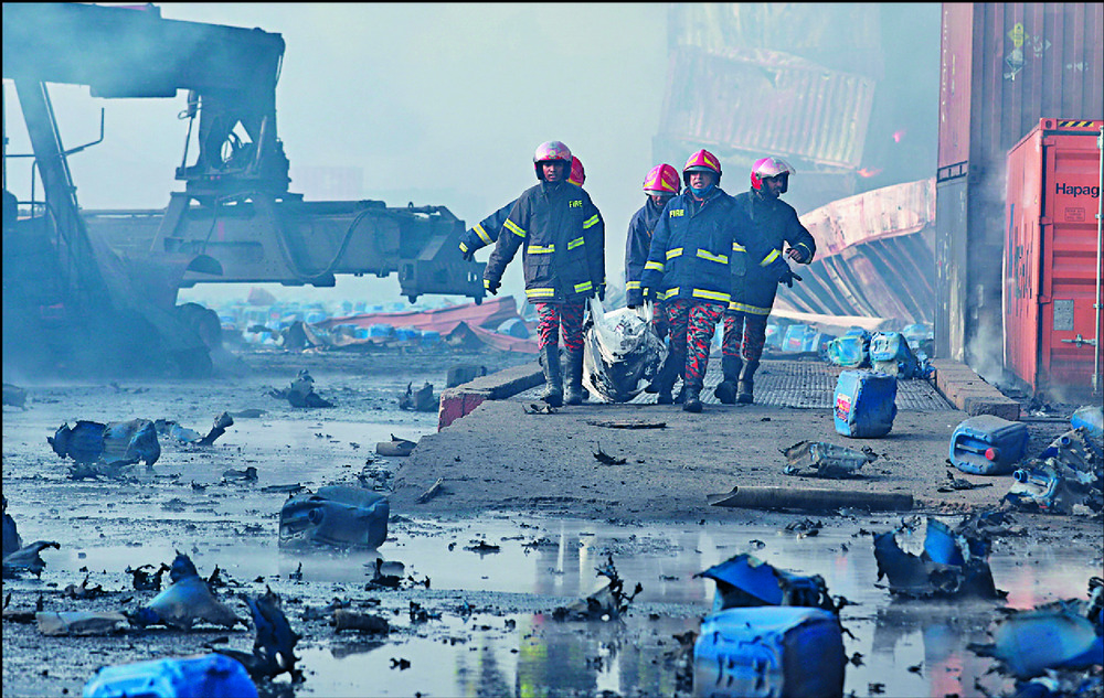 Firefighters retrieve the bodies of victims of the blaze at the depot in Sitakunda. REUTERS Firefighters retrieve the bodies of victims of the blaze at the depot in Sitakunda. REUTERS