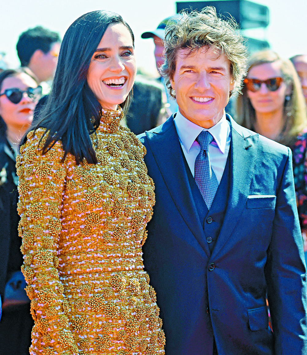 Costars Jennifer Connelly and Tom Cruise at a Top Gun: Maverick premiere. Left: Cruise gets star treatment at Cannes. Costars Jennifer Connelly and Tom Cruise at a Top Gun: Maverick premiere. Left: Cruise gets star treatment at Cannes.