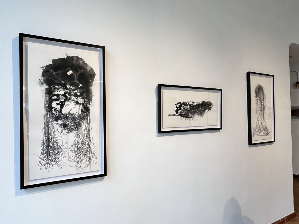 Artist Peter Nelson’s ink-on-paper works reference traditional Chinese scroll painting, with sculptural shapes resembling rocks, mountains and clouds drifting across the paintings.