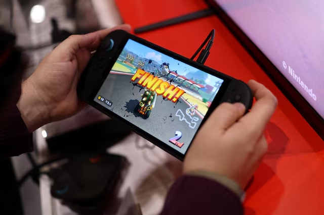 An attendee plays Mario Kart World by Nintendo Switch 2 during the Nintendo Switch 2 Experience at the ExCeL London international exhibition and convention centre in London, Britain, April 11, 2025. (Reuters)