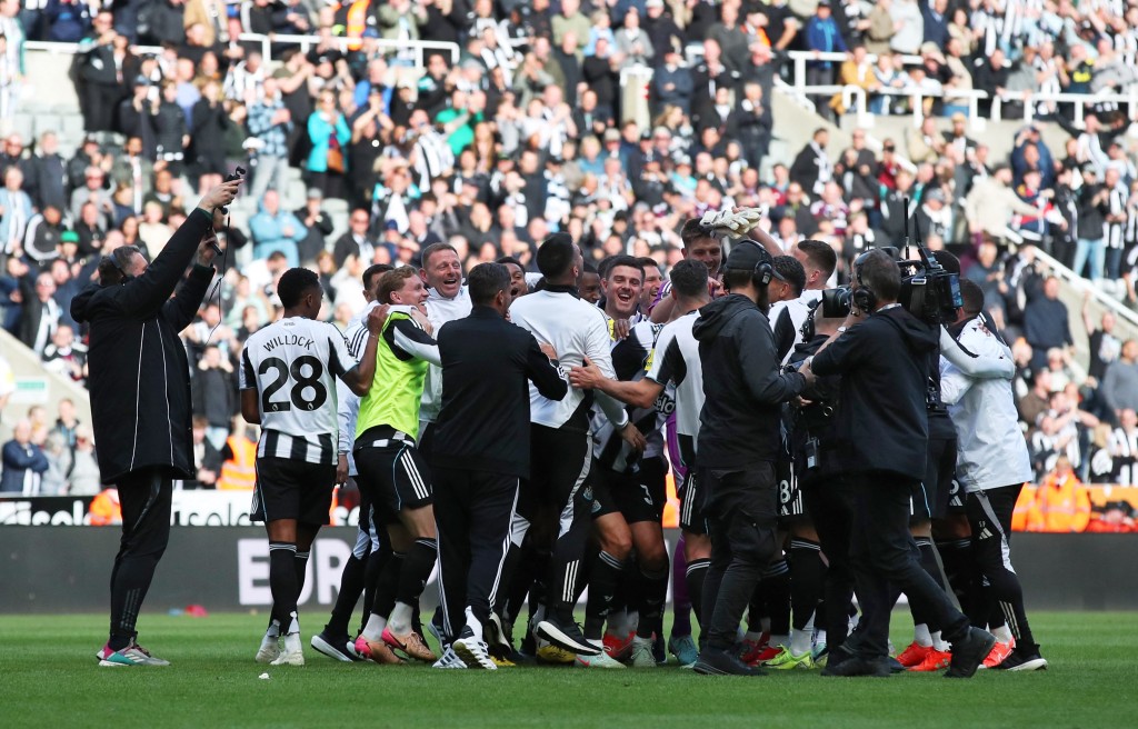 Newcastle United players celebrate qualifying for the Champions League after the match. (Reuters)