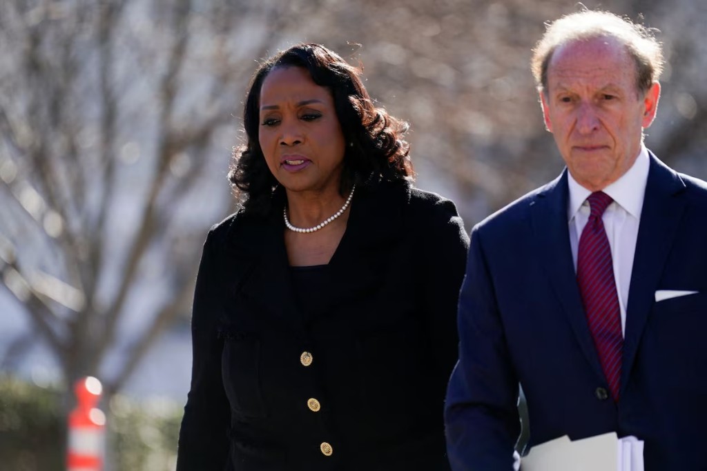 Federal Reserve Governor Lisa Cook, accompanied by lawyer Abbe Lowell, walks outside the U.S. Supreme Court, as Supreme Court justices consider U.S. President Donald Trump's effort to fire her, in Washington, D.C., U.S., January 21, 2026. REUTERS
