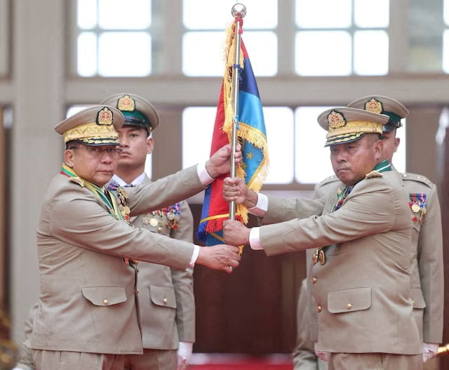 Myanmar junta chief Senior General Min Aung Hlaing hands over a flag to newly appointed Commander-in-Chief General Ye Win Oo during a ceremony in Naypyitaw, Myanmar, March 30, 2026. Myanmar Military True News Information Team/Handout via REUTERS