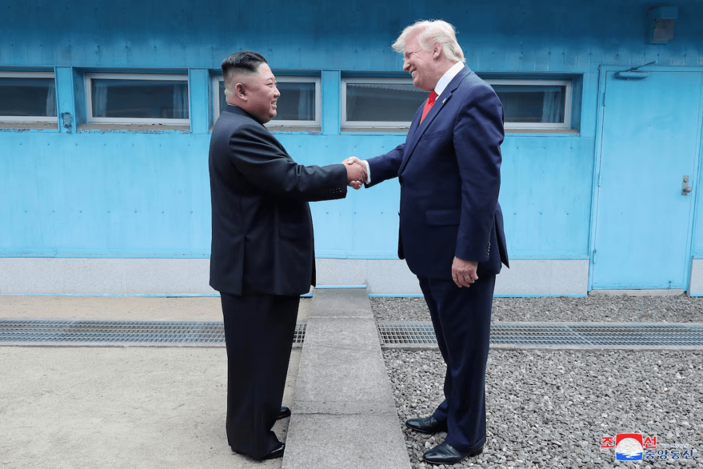 U.S. President Donald Trump shakes hands with North Korean leader Kim Jong Un as they meet at the demilitarized zone separating the two Koreas, in Panmunjom, South Korea, June 30, 2019. KCNA via REUTERS